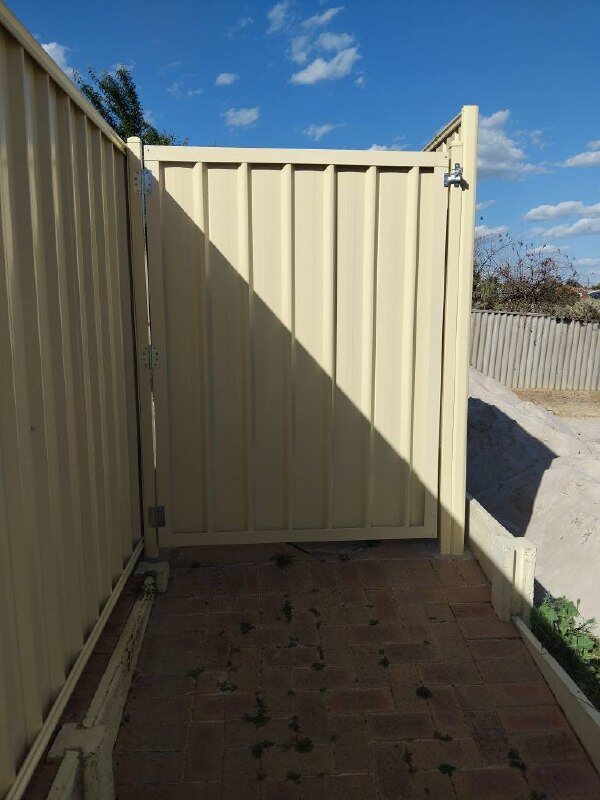 Cream Colorbond fence and gate