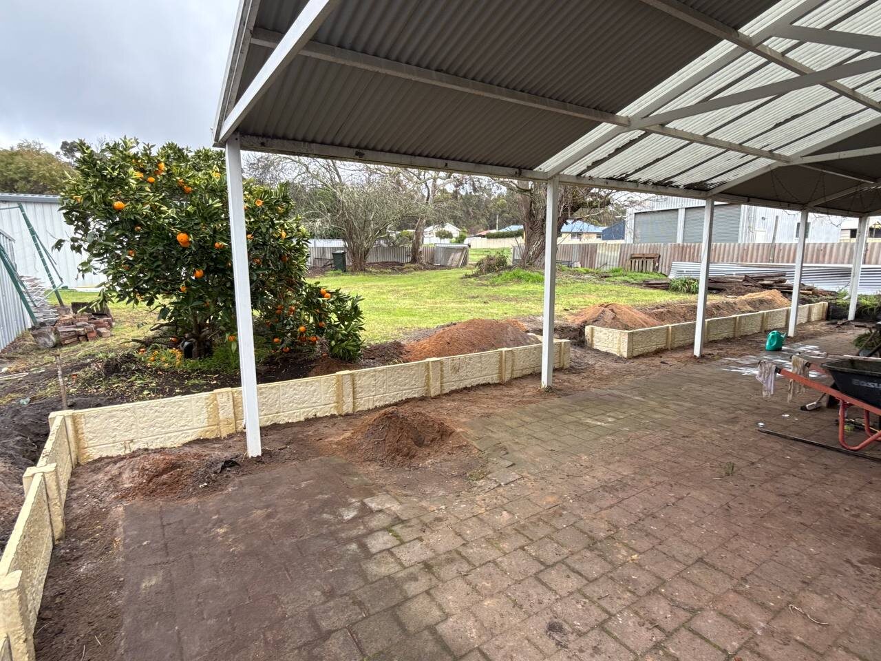 Limestone retaining wall under a patio
